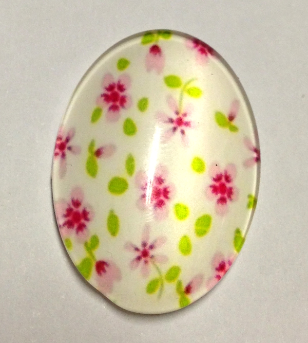 cabochon in vetro ovale con fiorellini rosa